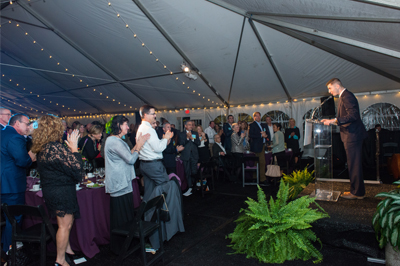 Keynote speaker, Blake Emerson, engages the crowd at the Art Ability preview reception dinner and auction