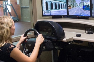 Person using driving simulator