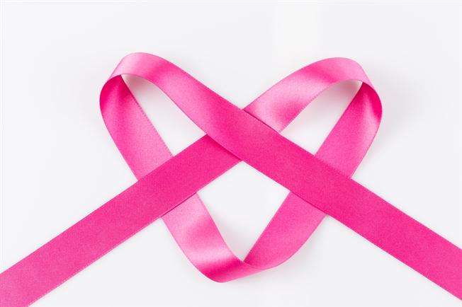 pink ribbon forming a heart
