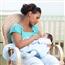 mother sitting in rocking chair with baby in lap