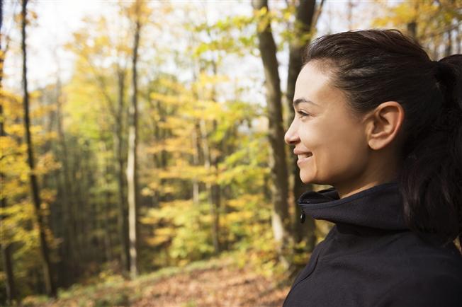 Woman looking happy during autumn