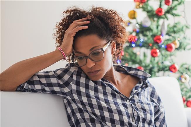 Woman looking depressed during holidays