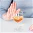 Close up on person refusing an alcoholic drink with a hand signal