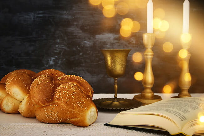 Challah bread, wine and candles for Shabbat