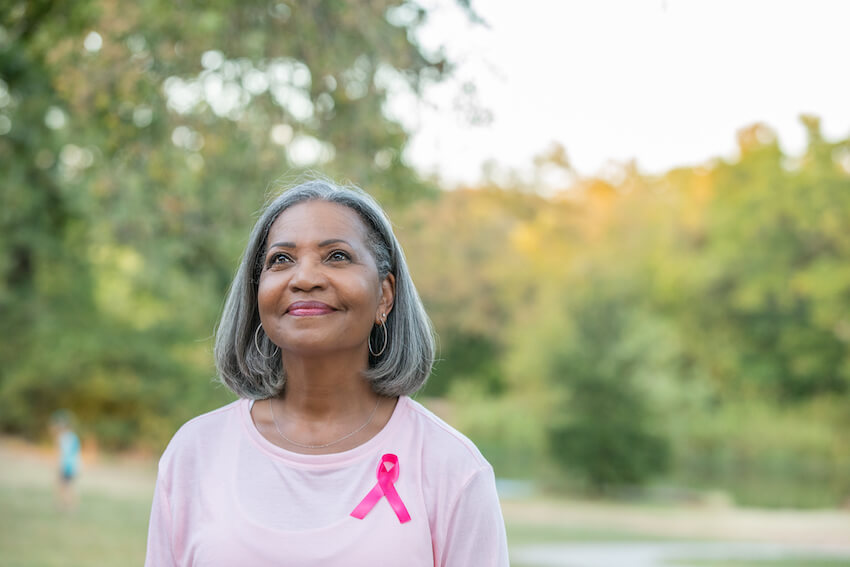 breast cancer survivor looking hopeful