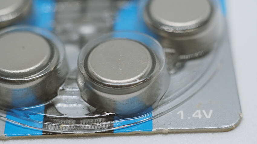 Close up of button batteries in device