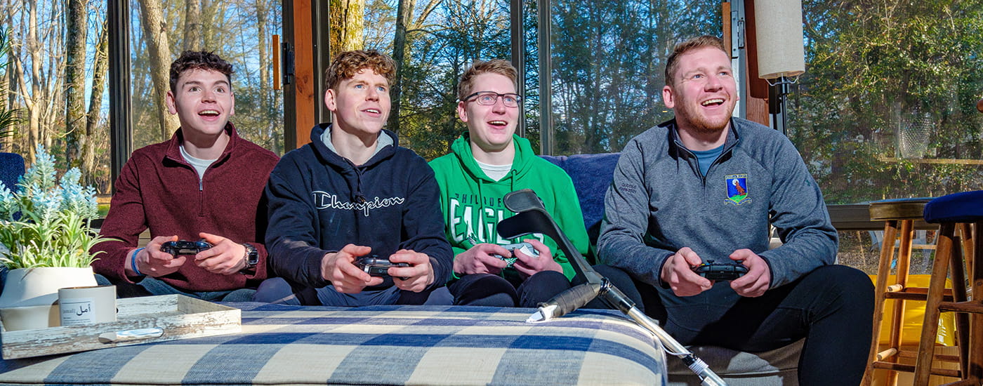 Cole Keith and his friends playing a video game.