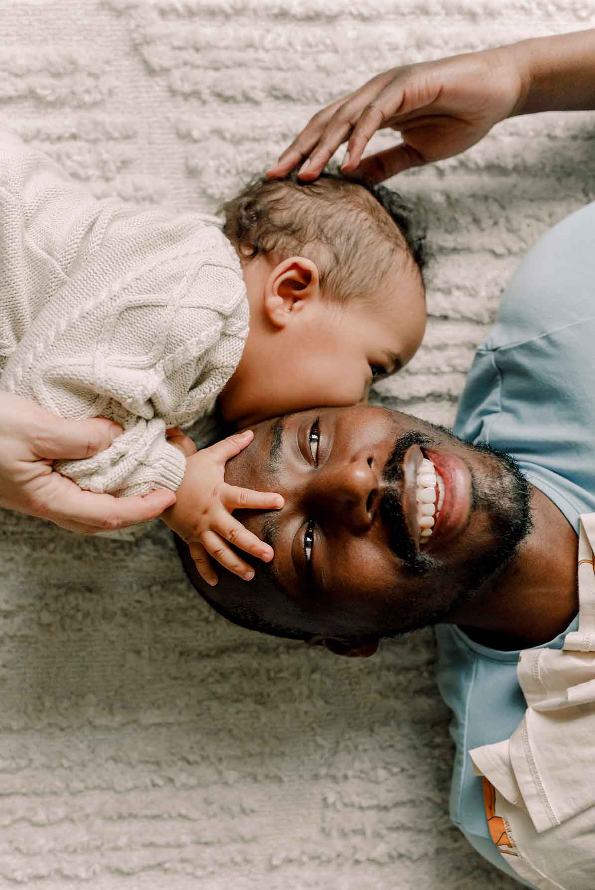 Baby kissing father