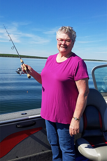 Ann enjoying fishing and "the good life" after robotic coronary bypass surgery