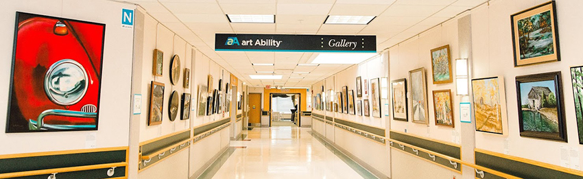 View down the Art Ability gallery hallway at Bryn Mawr Rehab Hospital